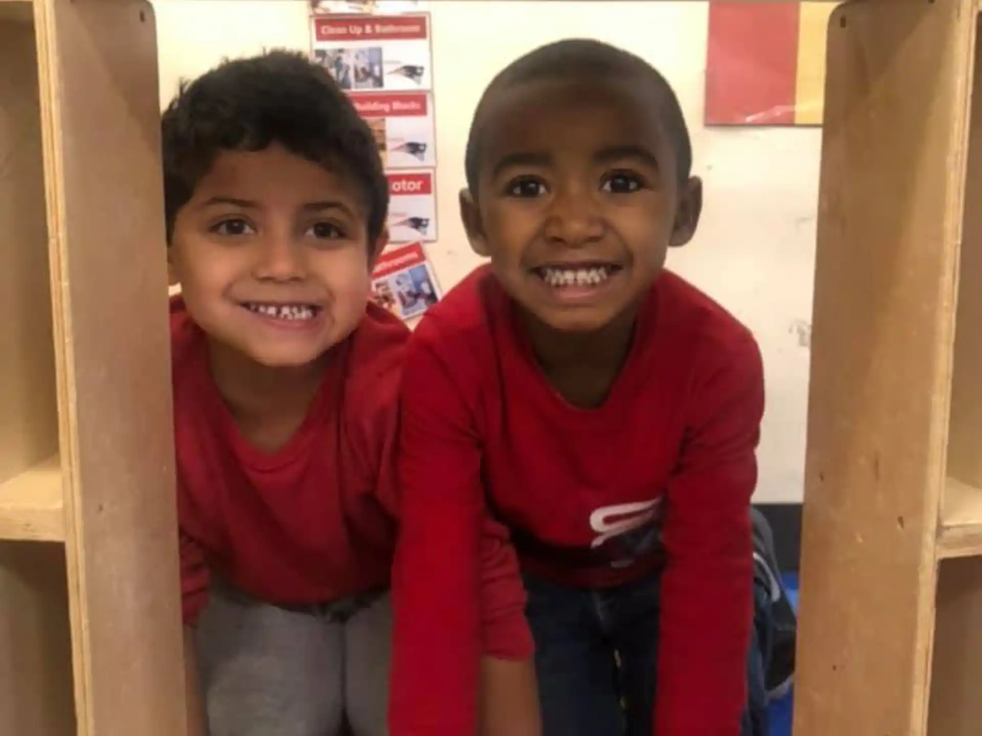 a couple of children smiling