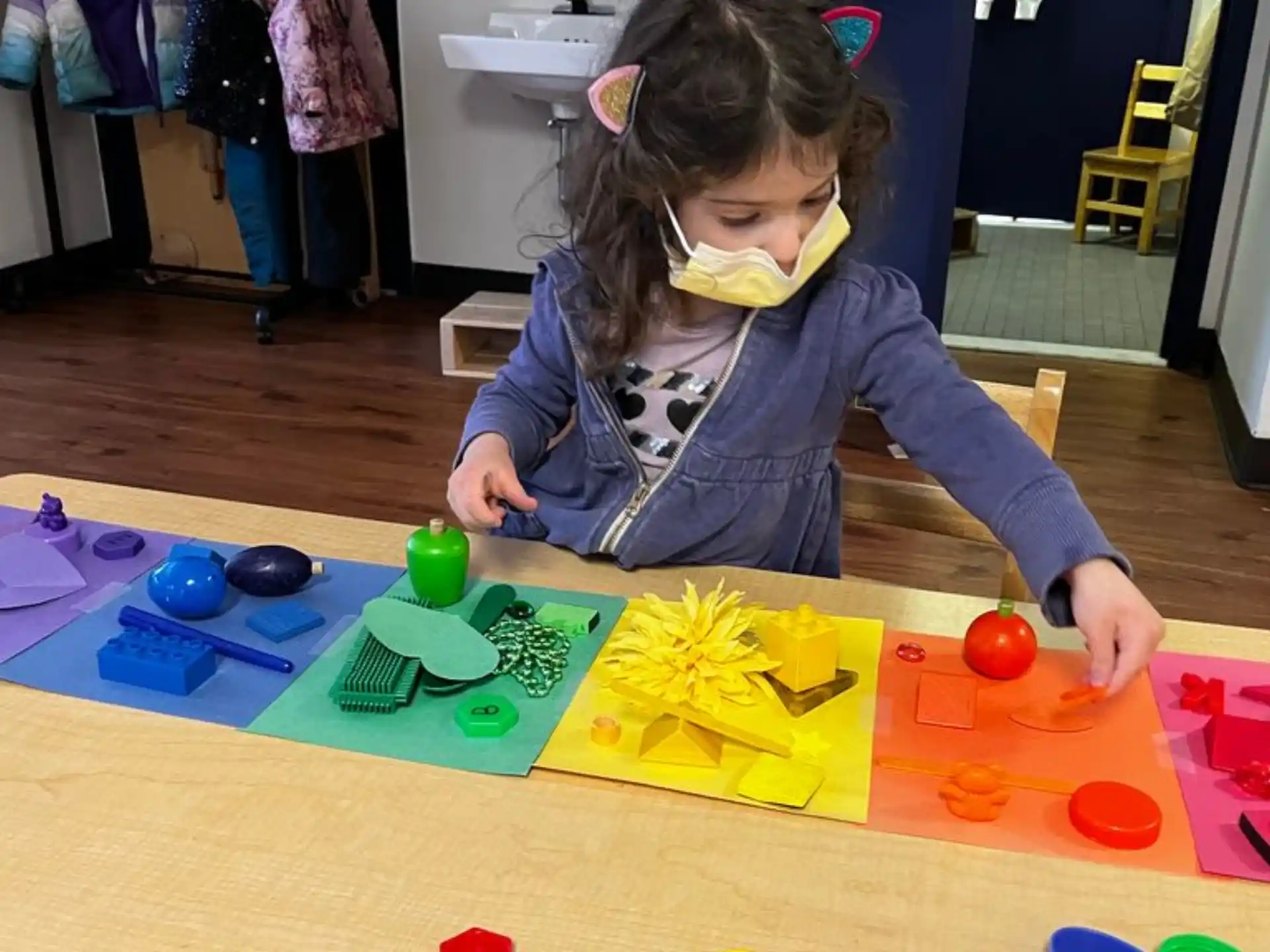 a girl painting on a table
