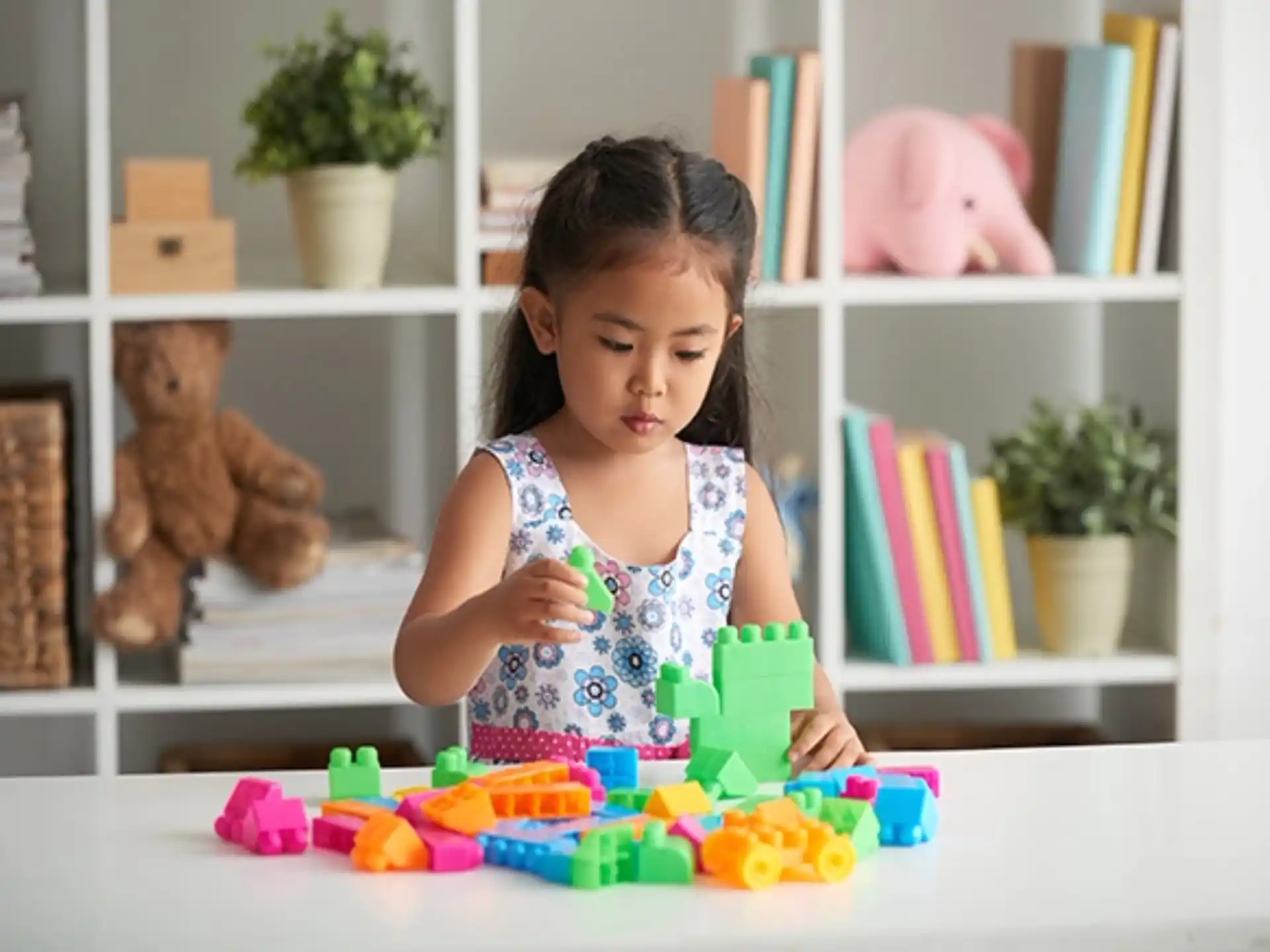 a little girl playing with toys