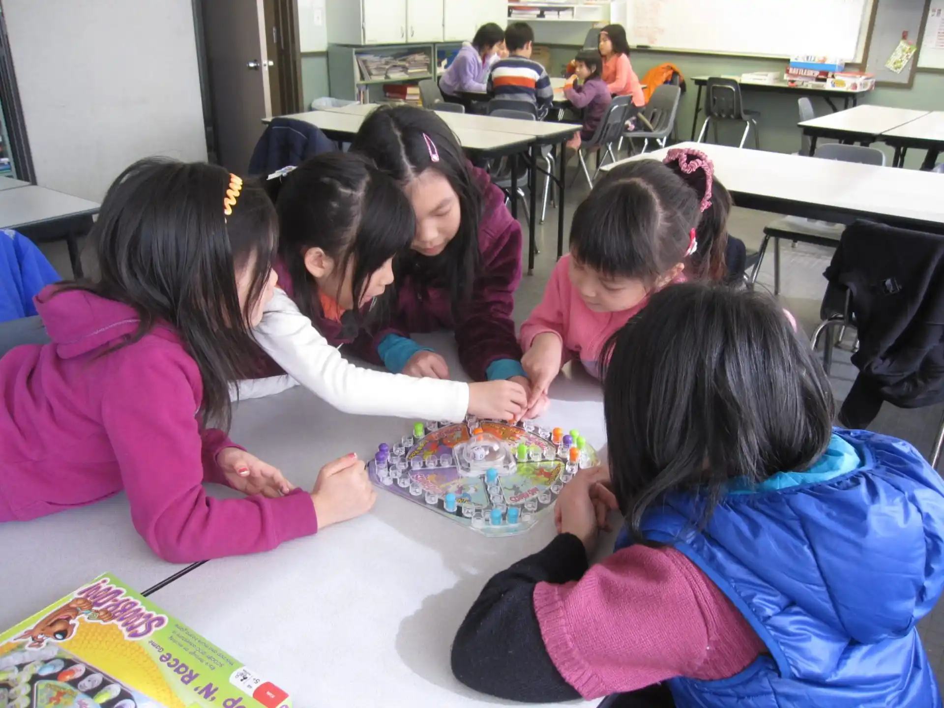a group of children playing with a toy