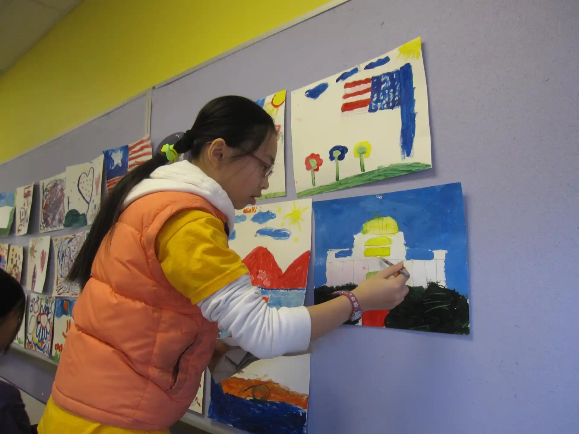 a person painting on a wall