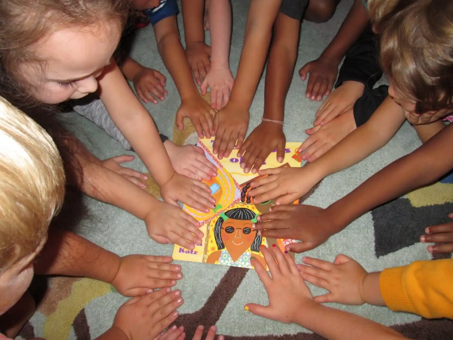 a group of children playing with a puzzle