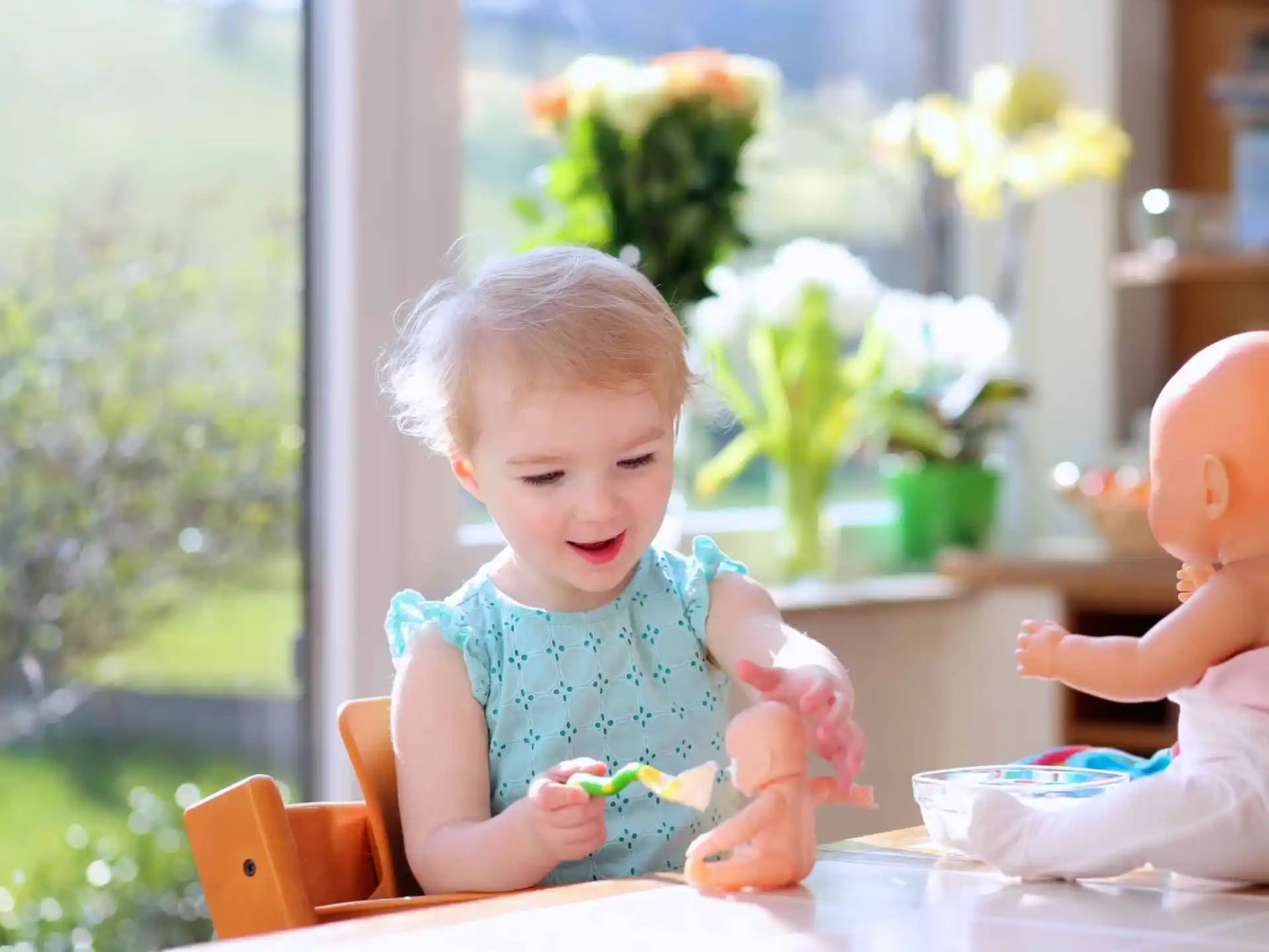 a baby sitting at a table
