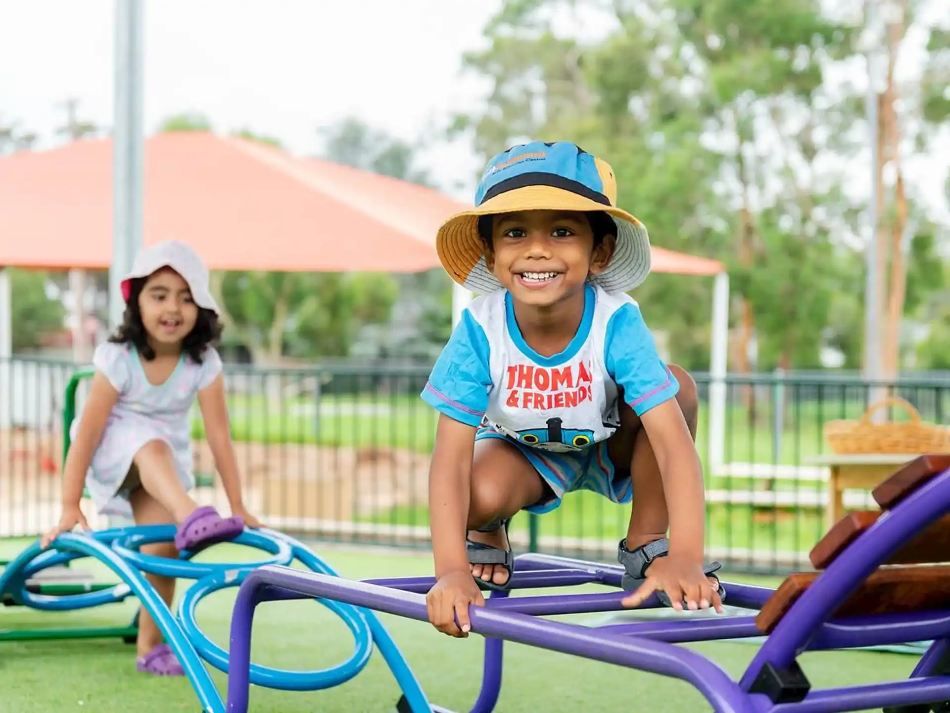 a couple of kids on a playground
