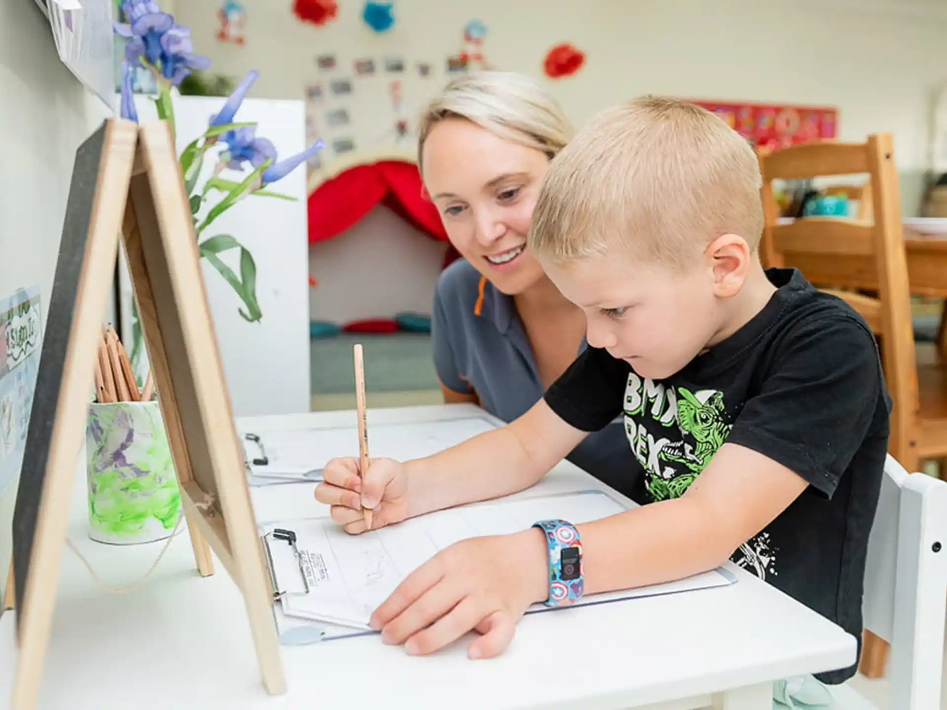 a person and a boy painting