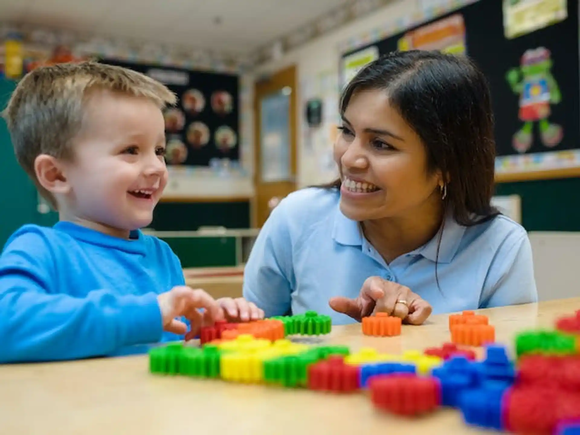 a person and a child playing with toys