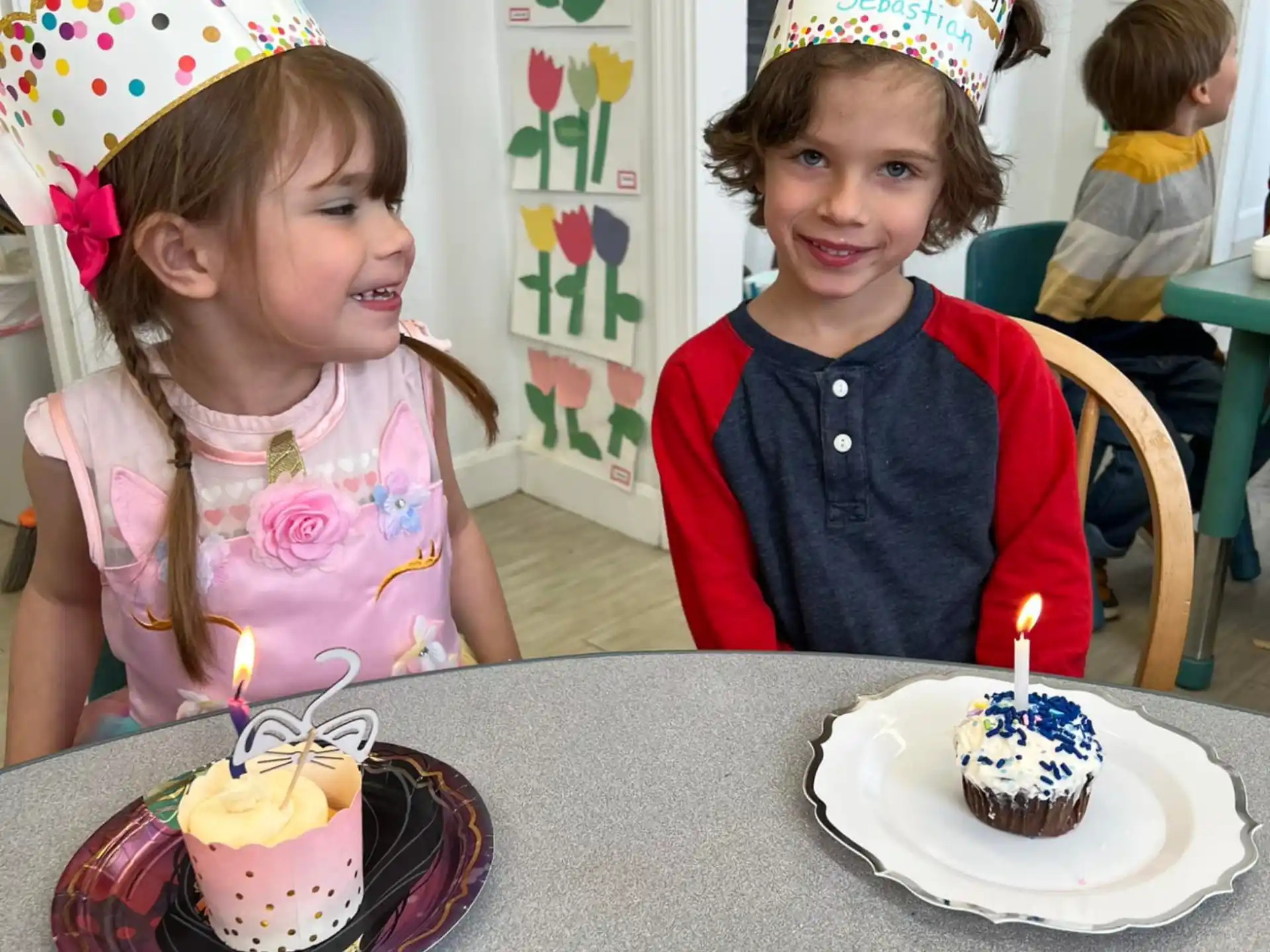 kids with birthday hats on