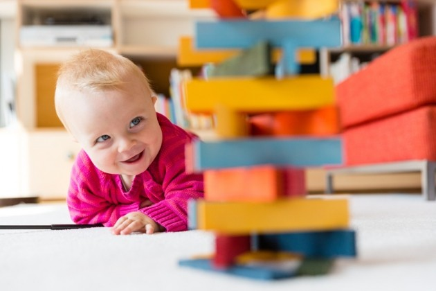 a baby sitting at a table