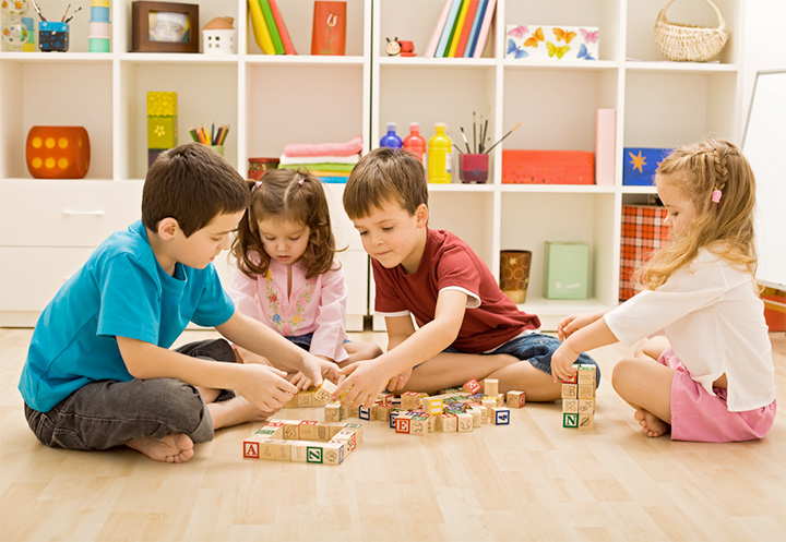 a group of children playing with toys
