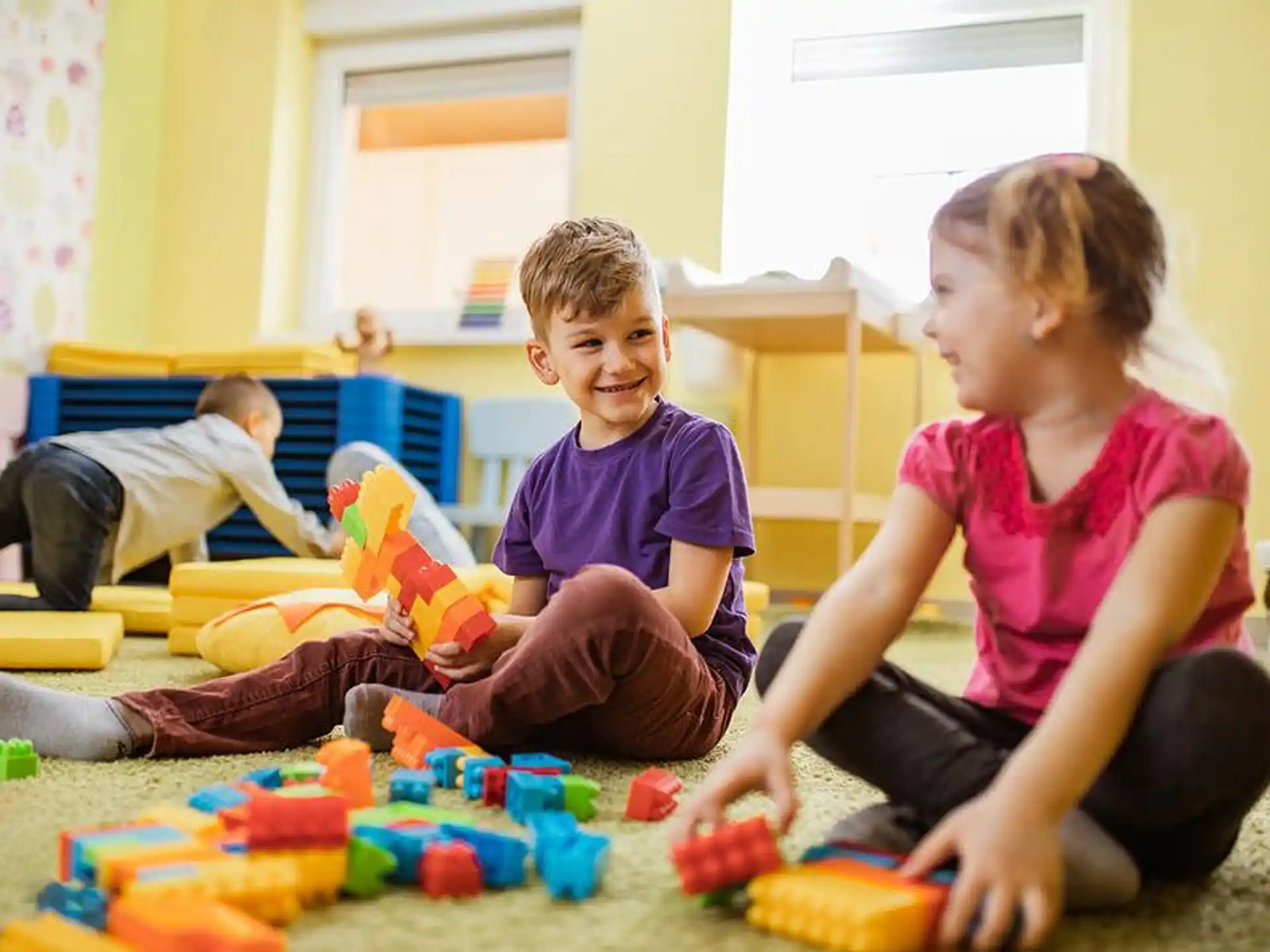 a group of children playing with toys