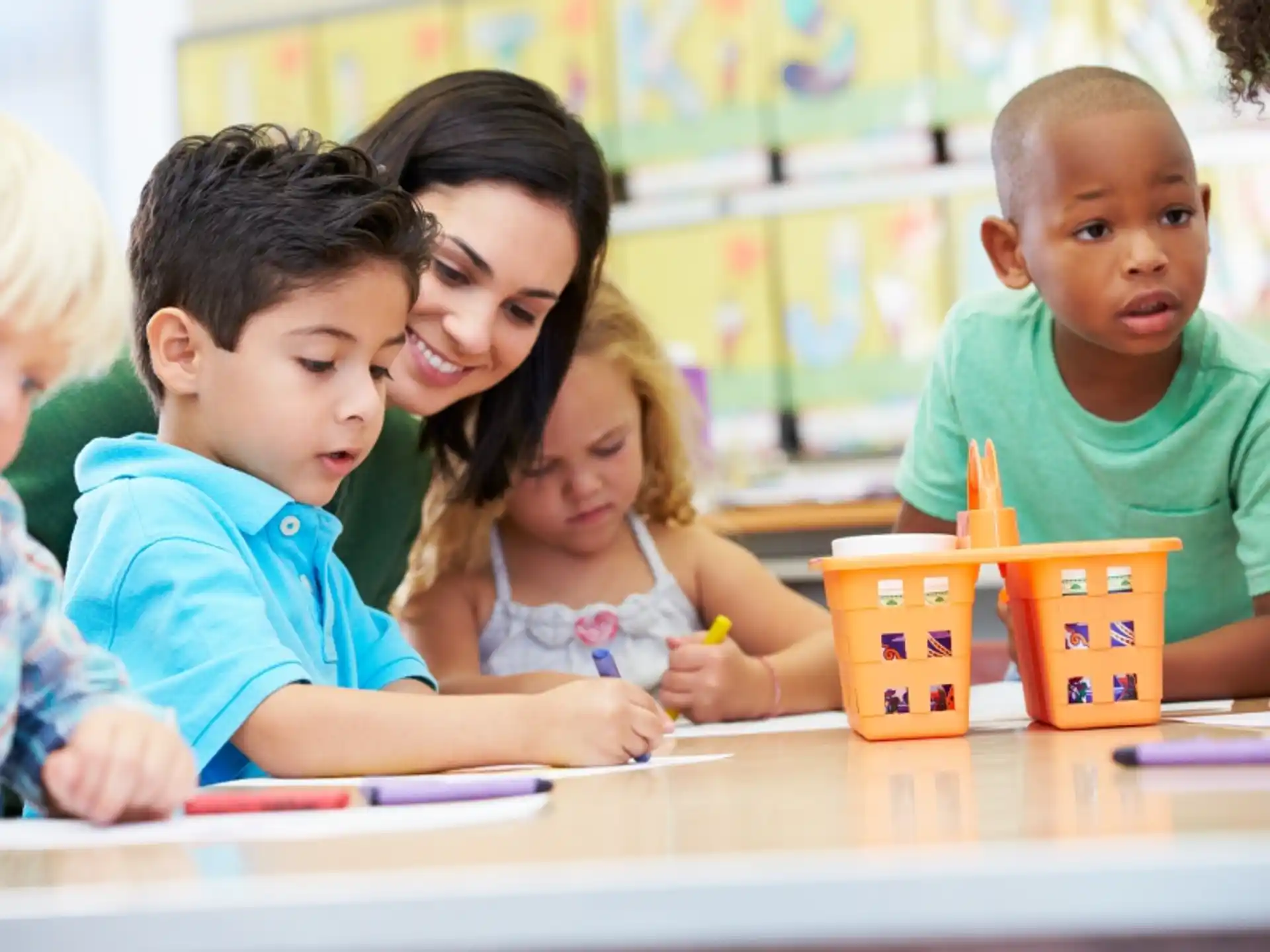 a group of children sitting at a table