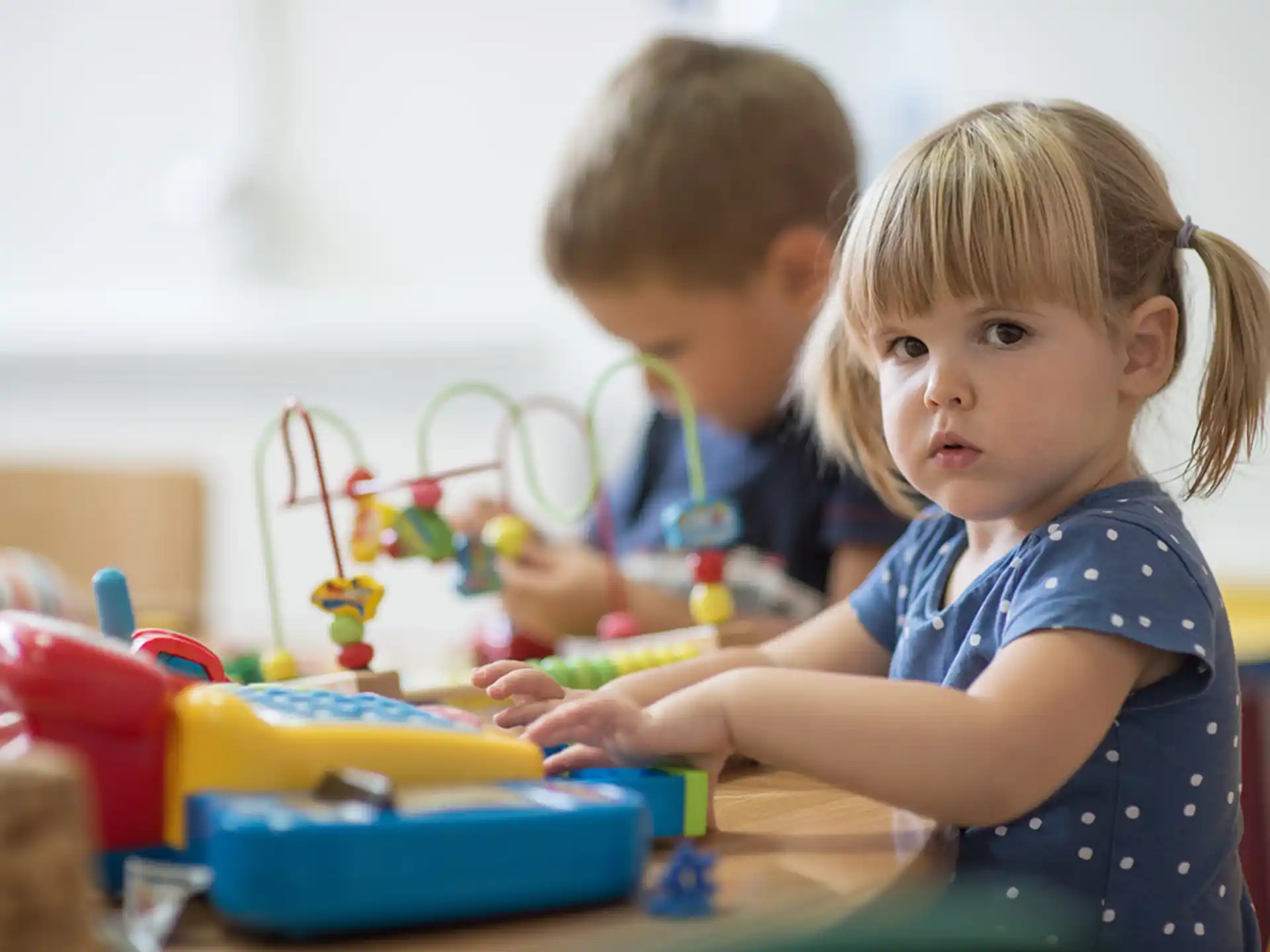 a couple of children playing with toys