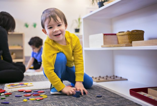 a boy sitting on the floor