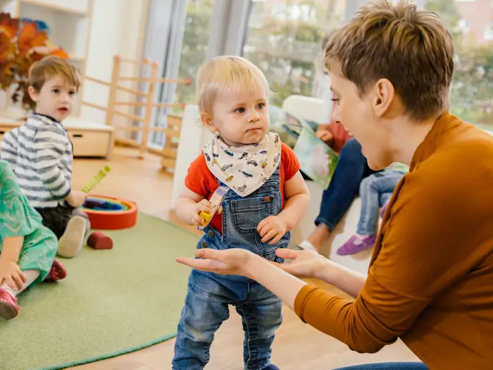 a group of children playing with toys