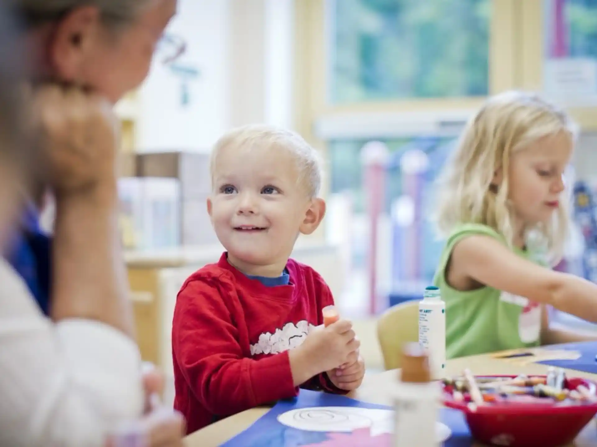 a child sitting at a table