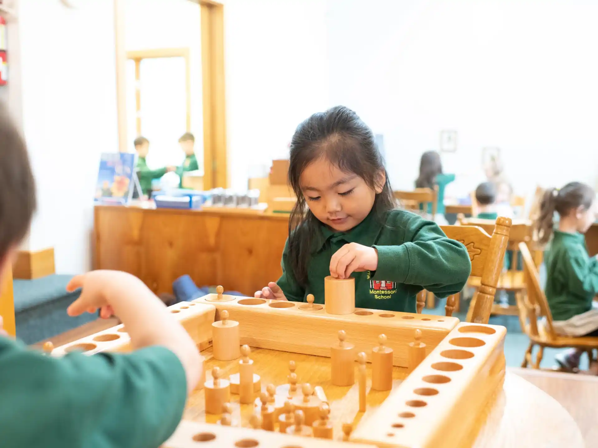 a group of children playing chess