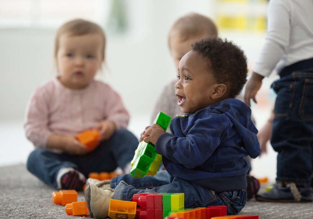 a group of children playing with toys