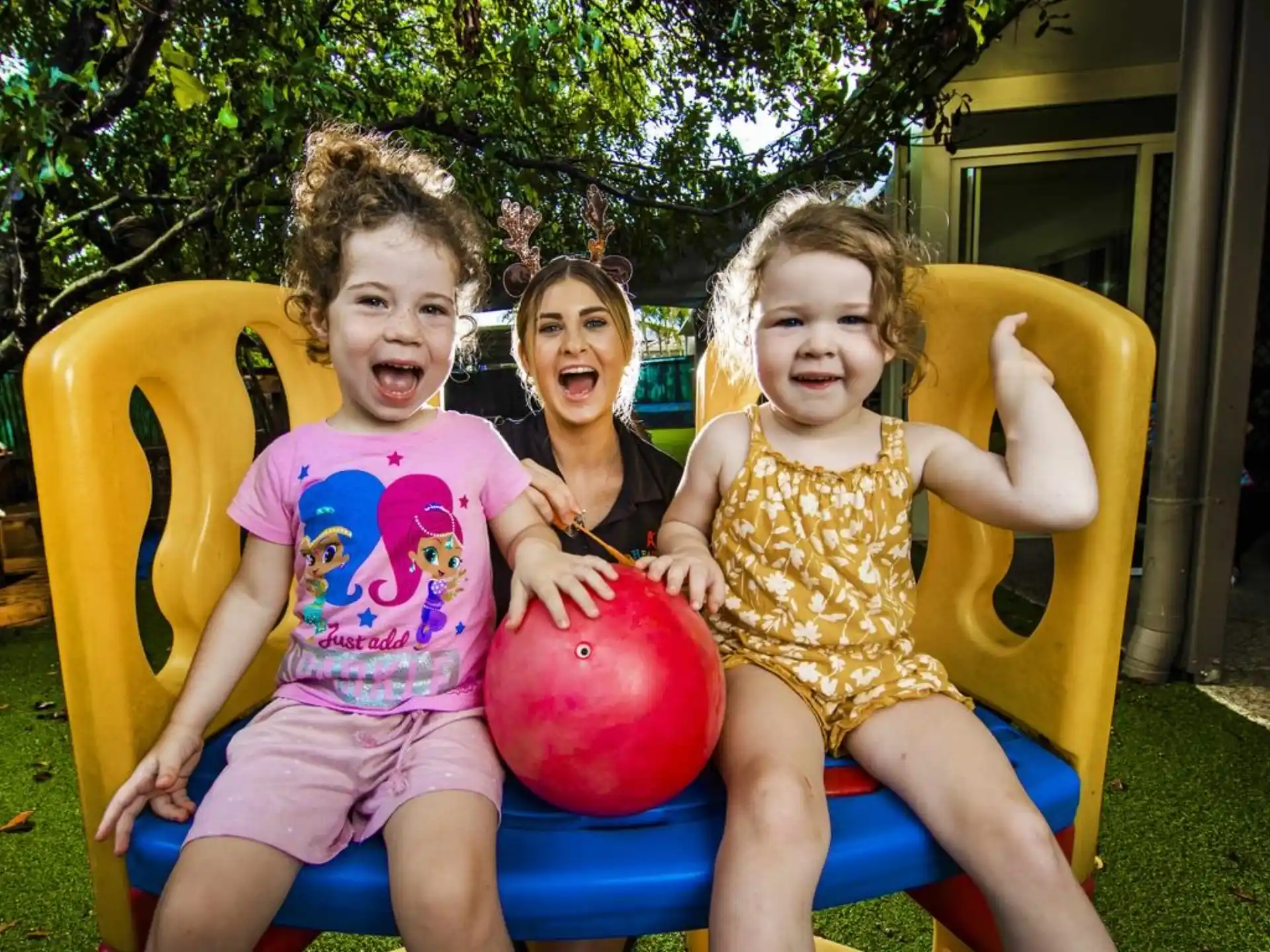 a group of children sitting on a slide