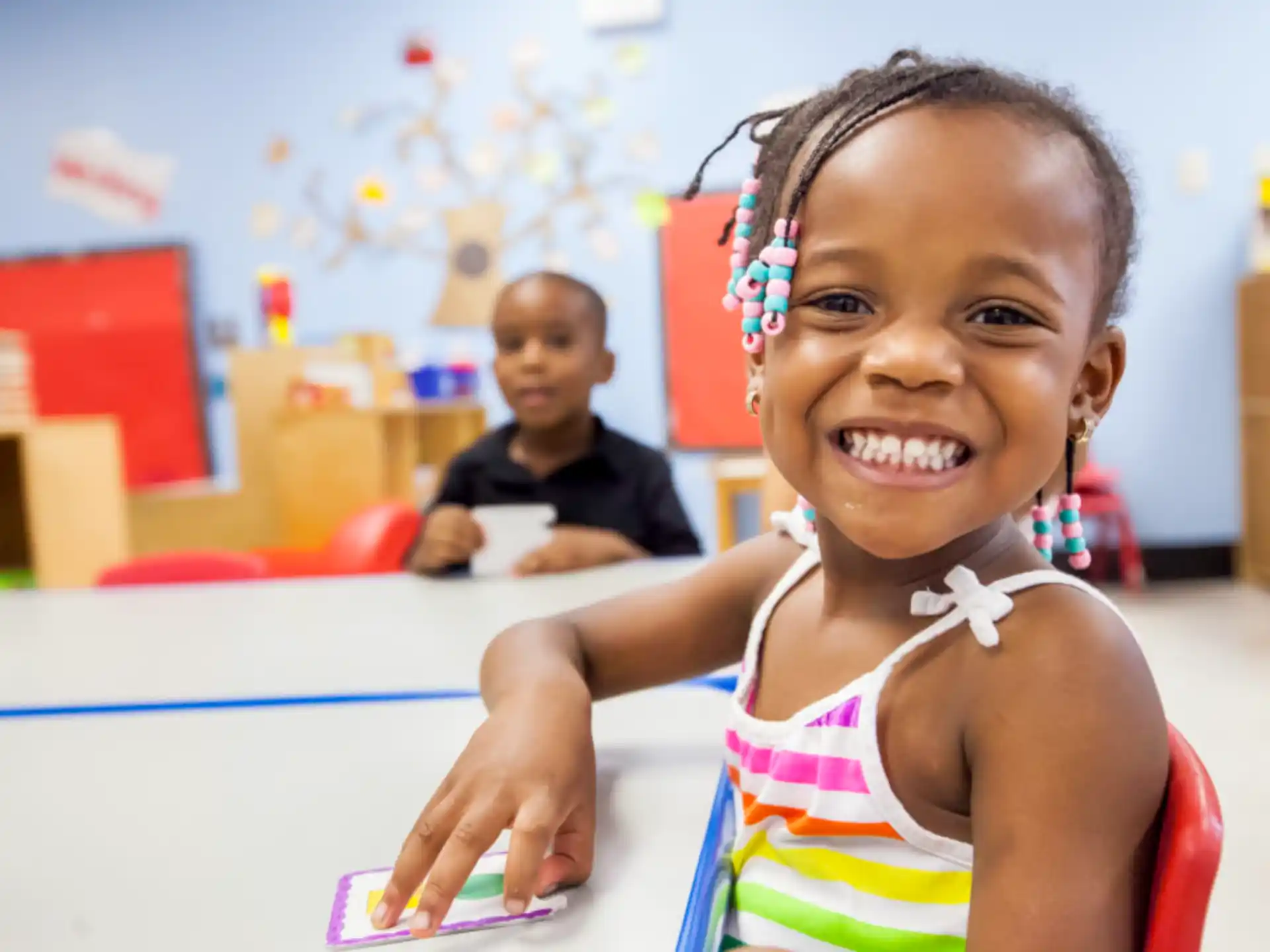 a young girl smiling