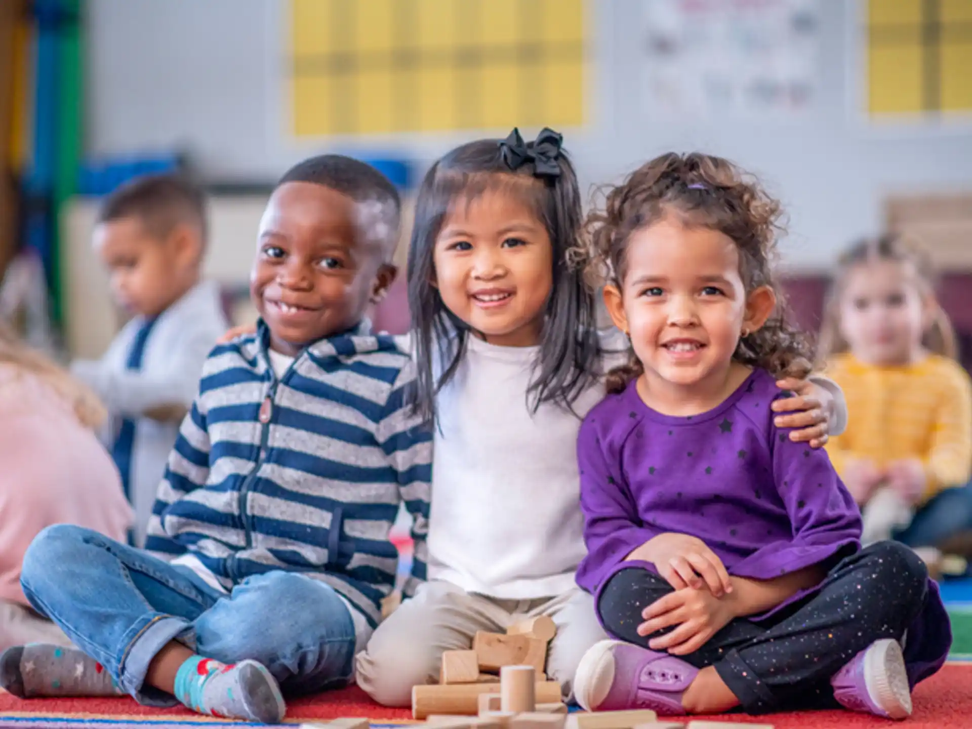 a group of children sitting on the floor