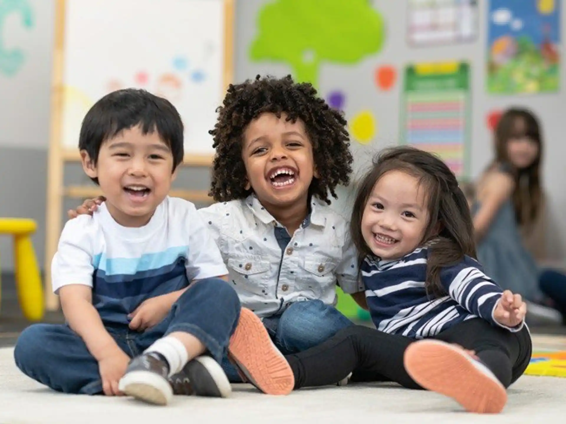 a group of children sitting on the floor