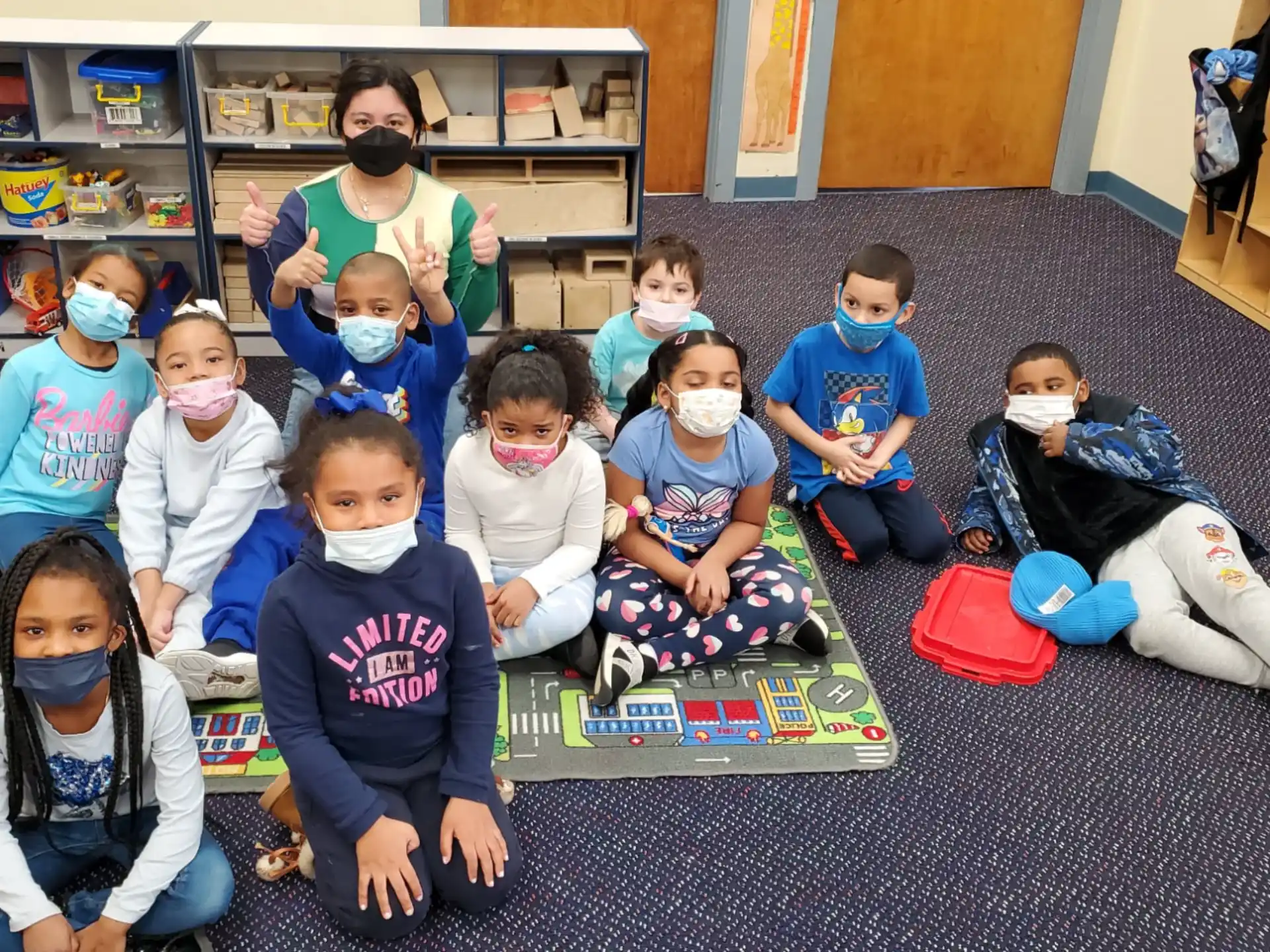 a group of children sitting on the floor