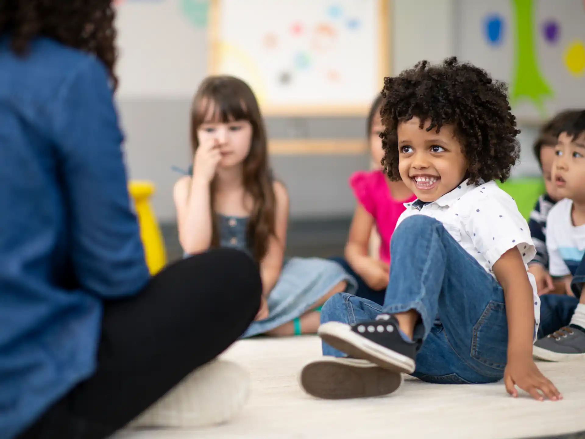 a group of children sitting on the floor
