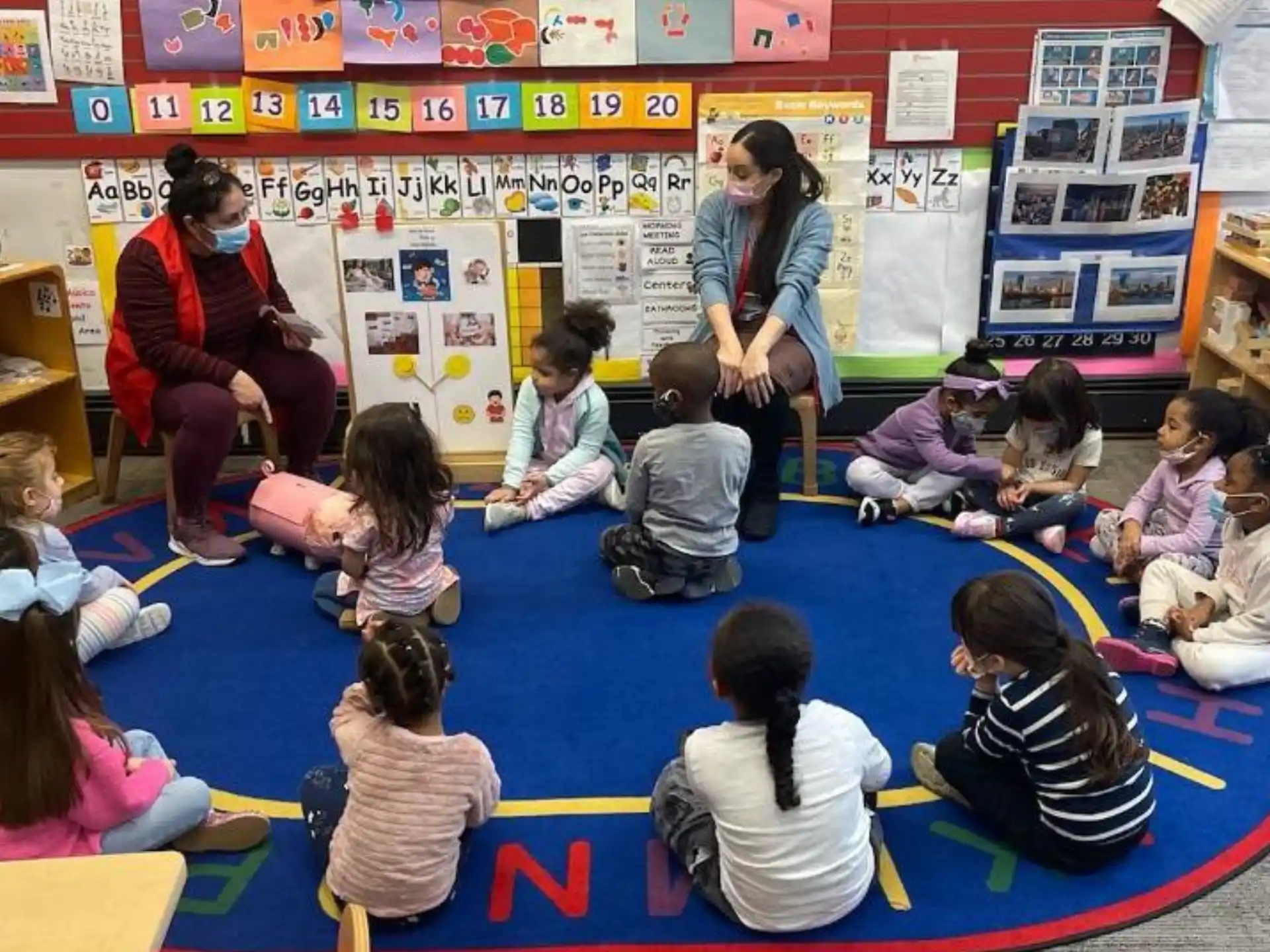 a person teaching a group of children