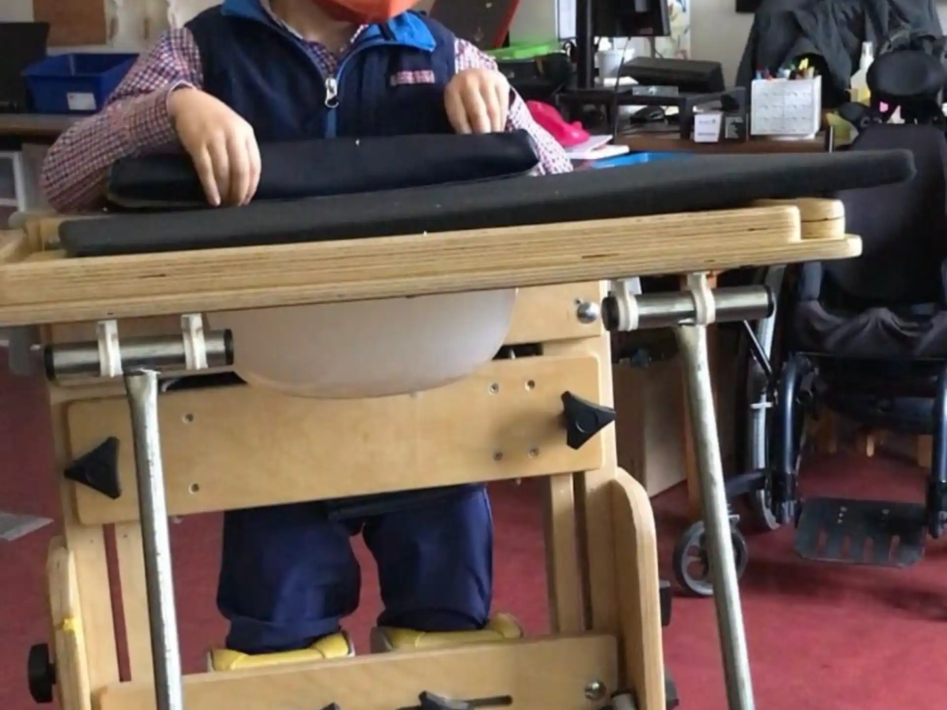 a boy sitting at a desk