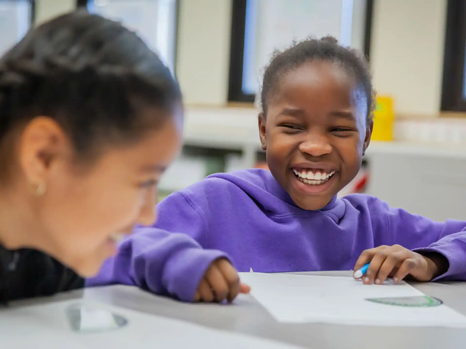 a person and a child smiling