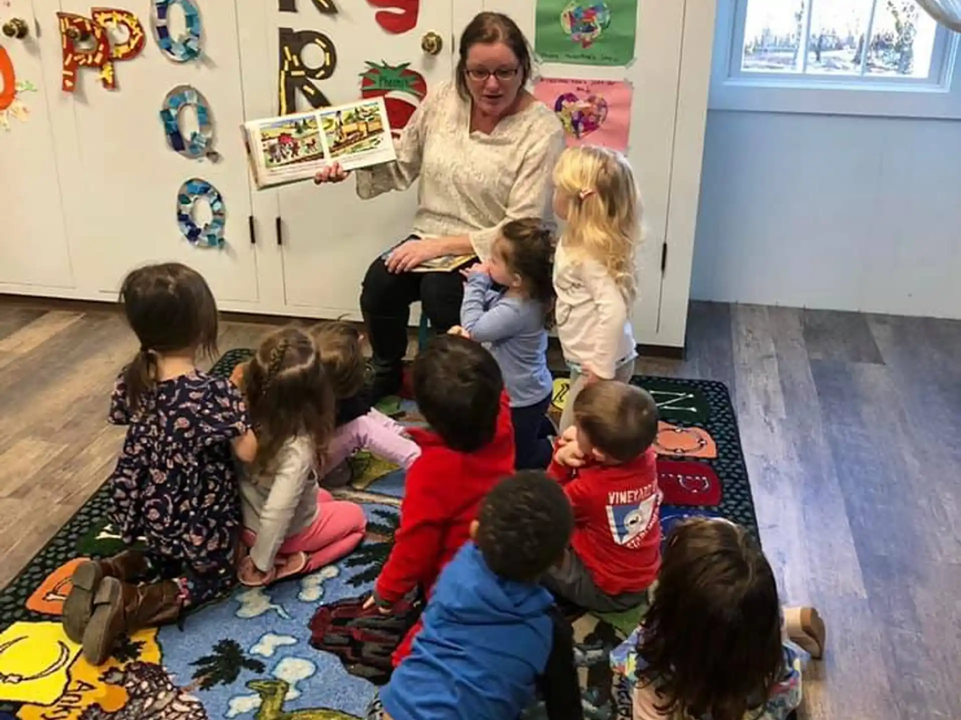 a person teaching children in a classroom