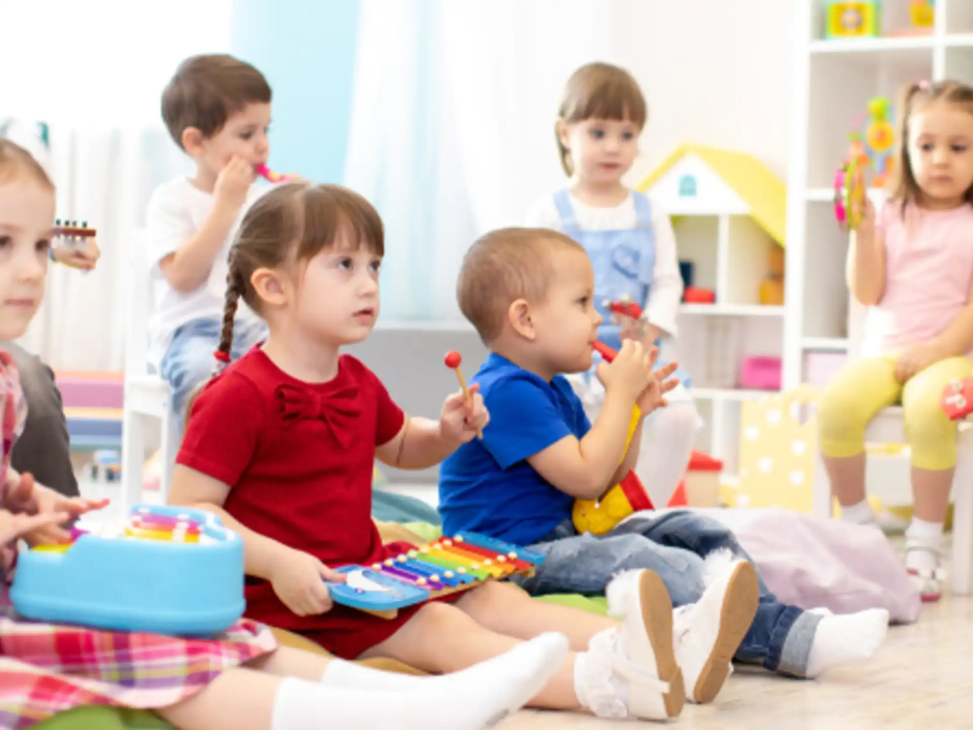 a group of children sitting on the floor