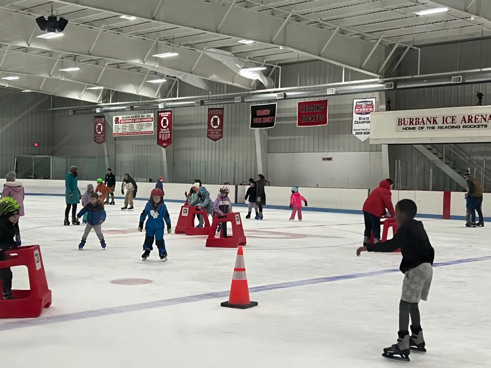 people on ice skates in an ice rink