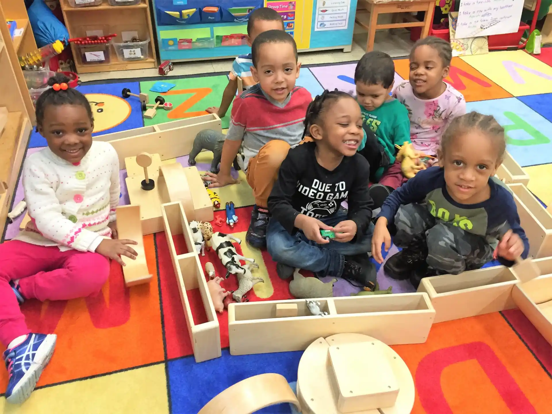 a group of children playing with toys