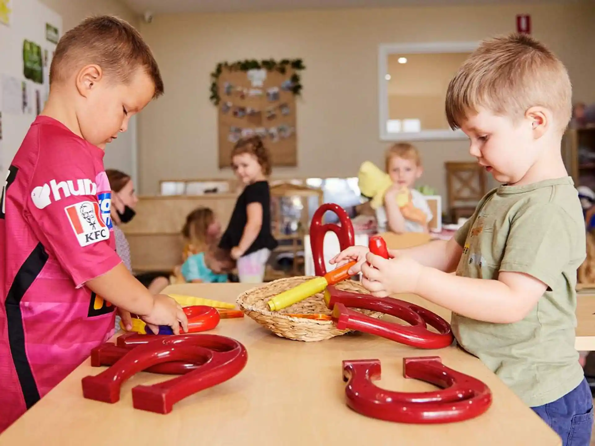 a couple of kids playing with toys