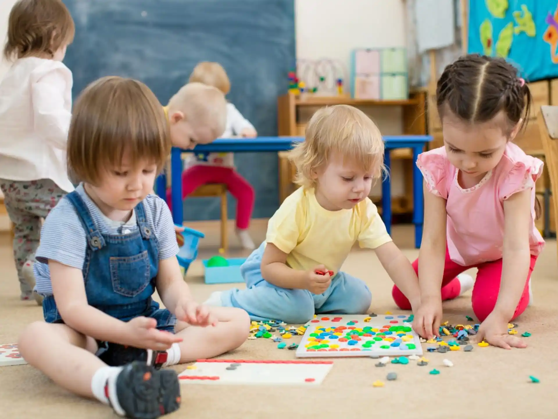 a group of children sitting on the floor