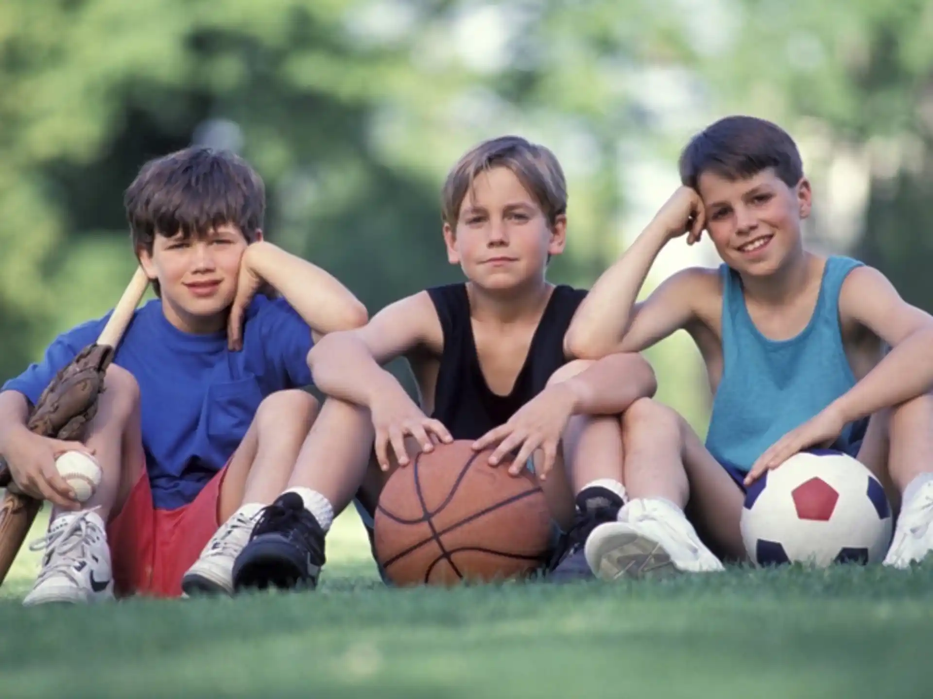 a group of kids playing football