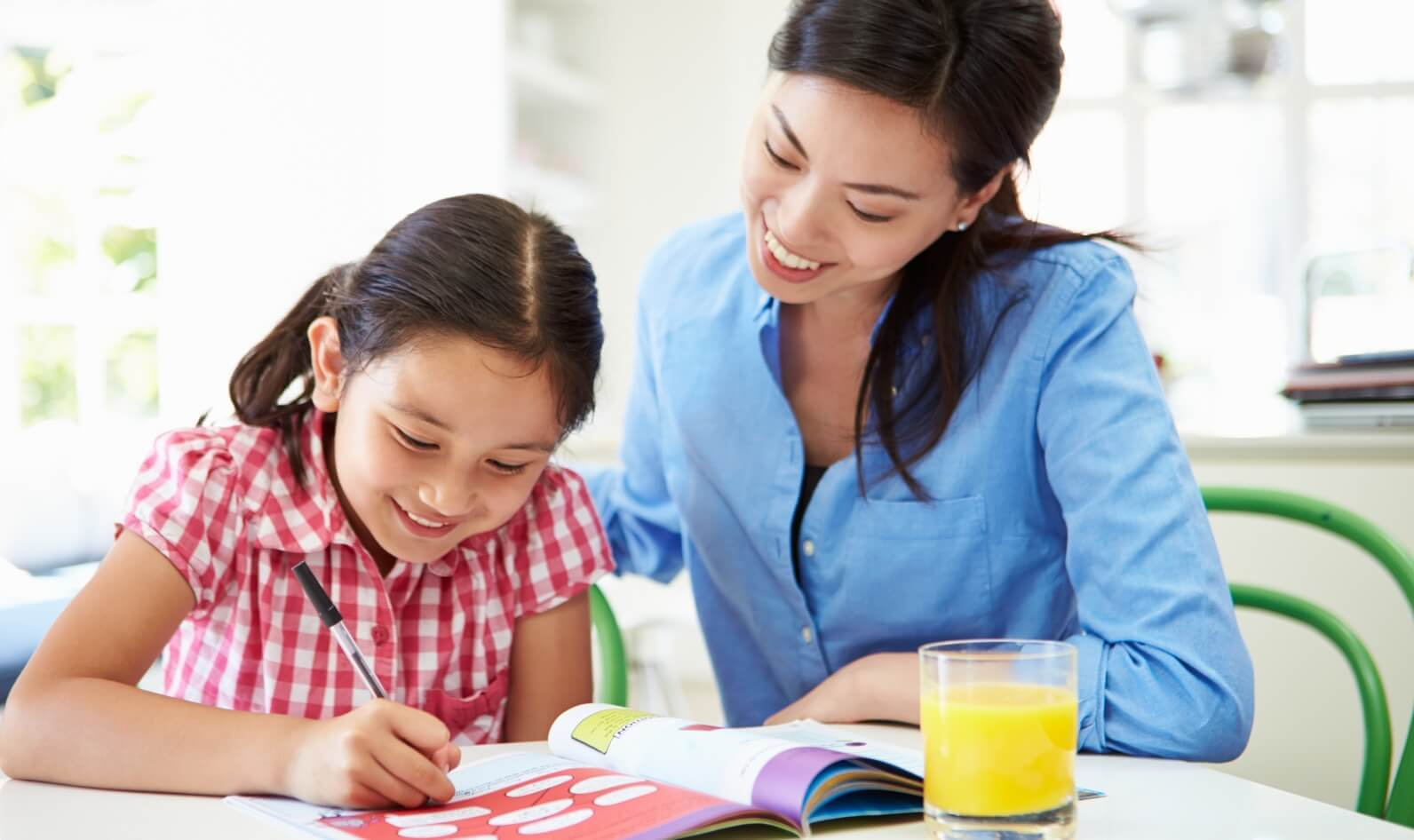 a woman and a child studying