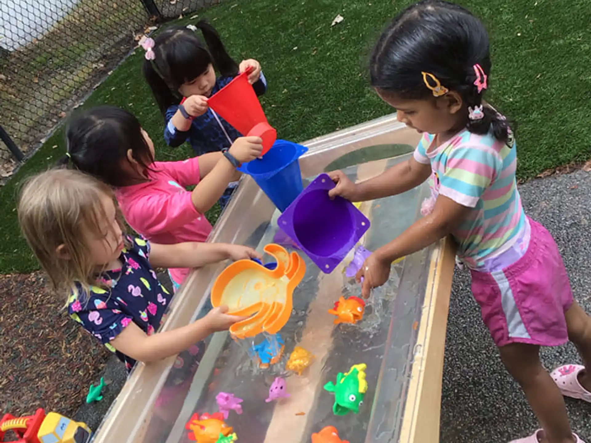 a group of children playing in a play area