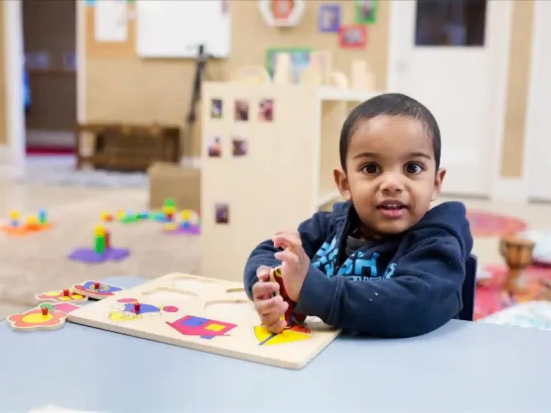 a child sitting at a table