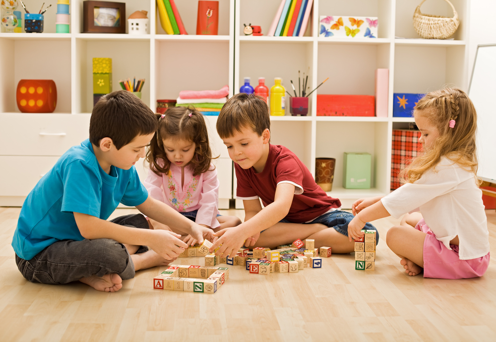 a group of children playing with toys