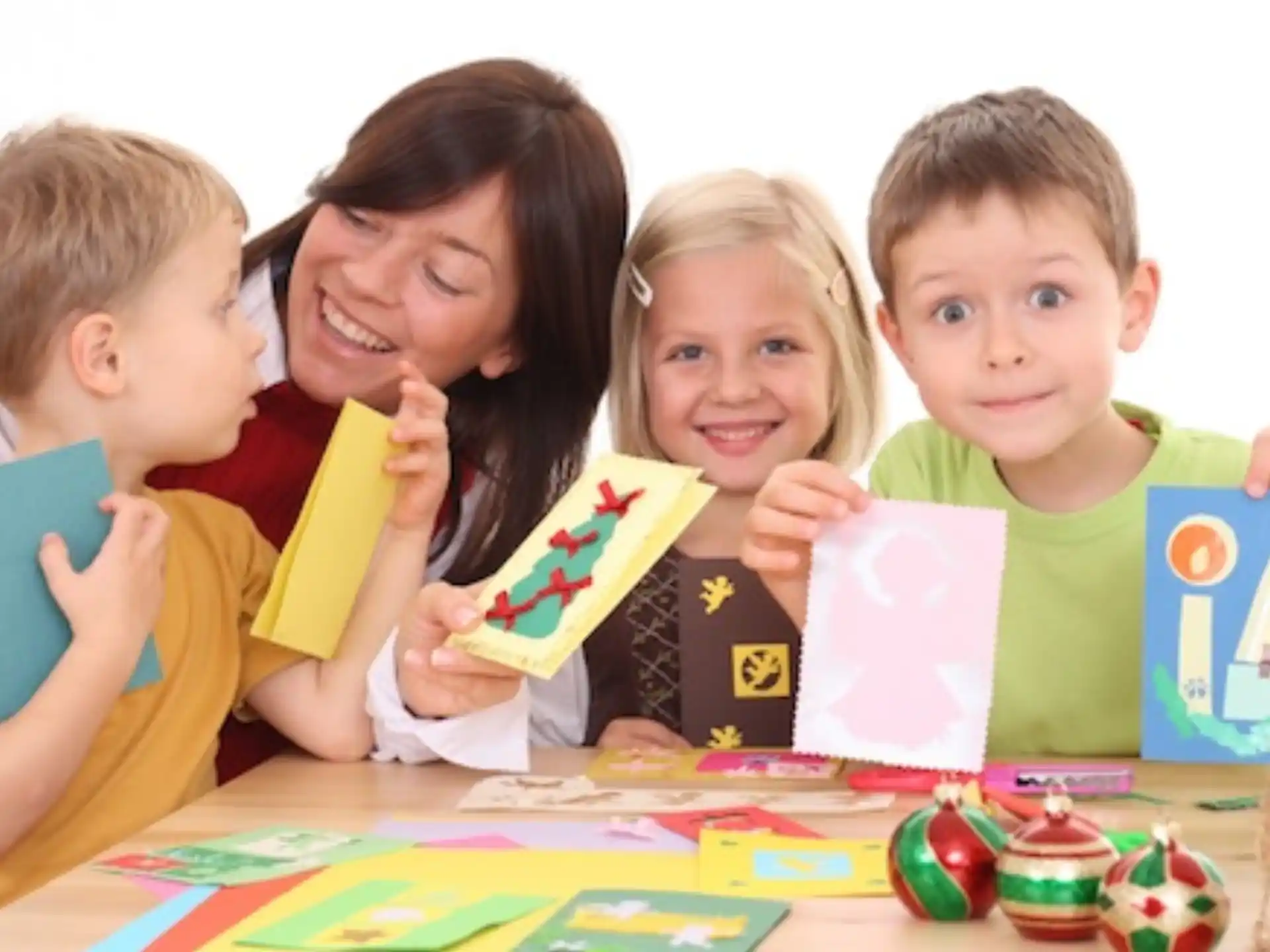 a person and children holding up books