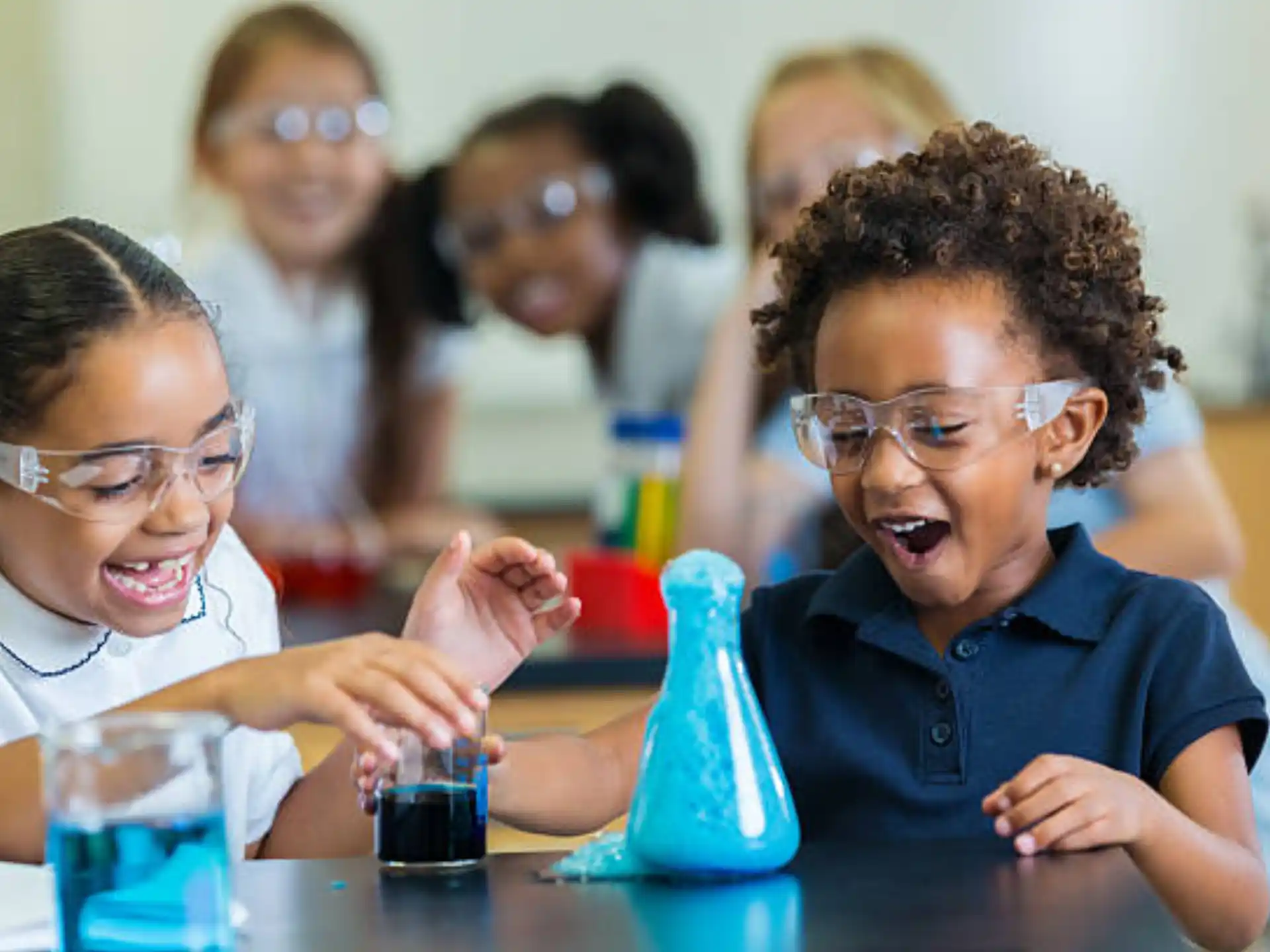 medium shot of kids looking at a device