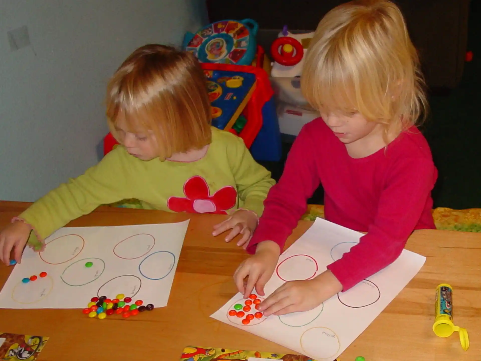 a couple of children playing with toys
