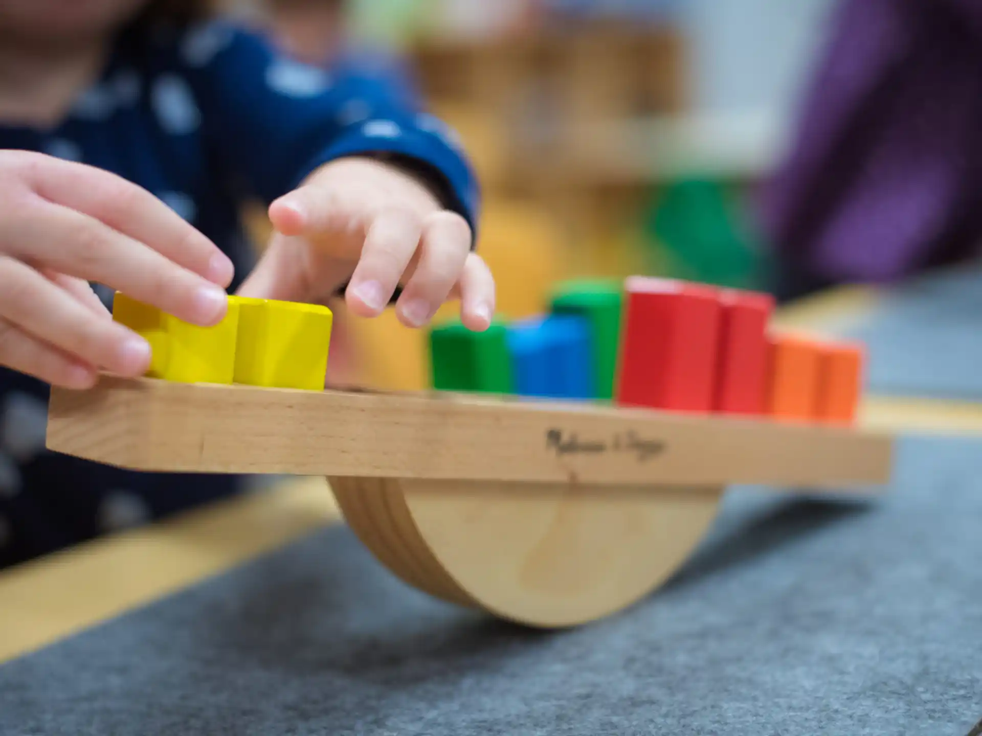 a person building a building blocks