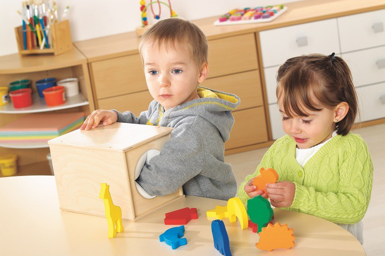a couple of children playing with toys