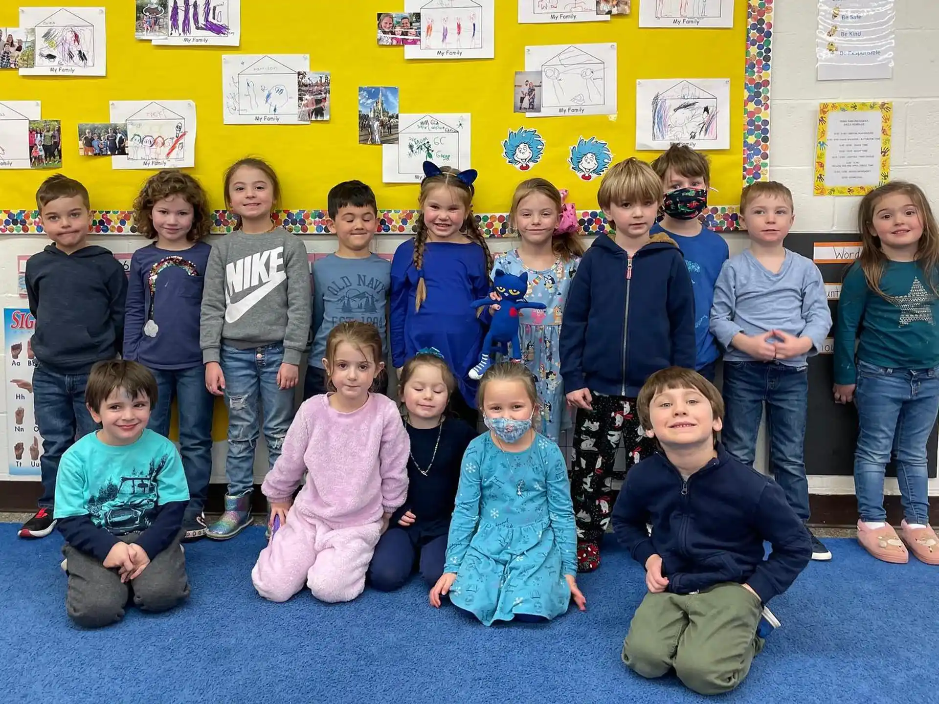 a group of children posing for a photo
