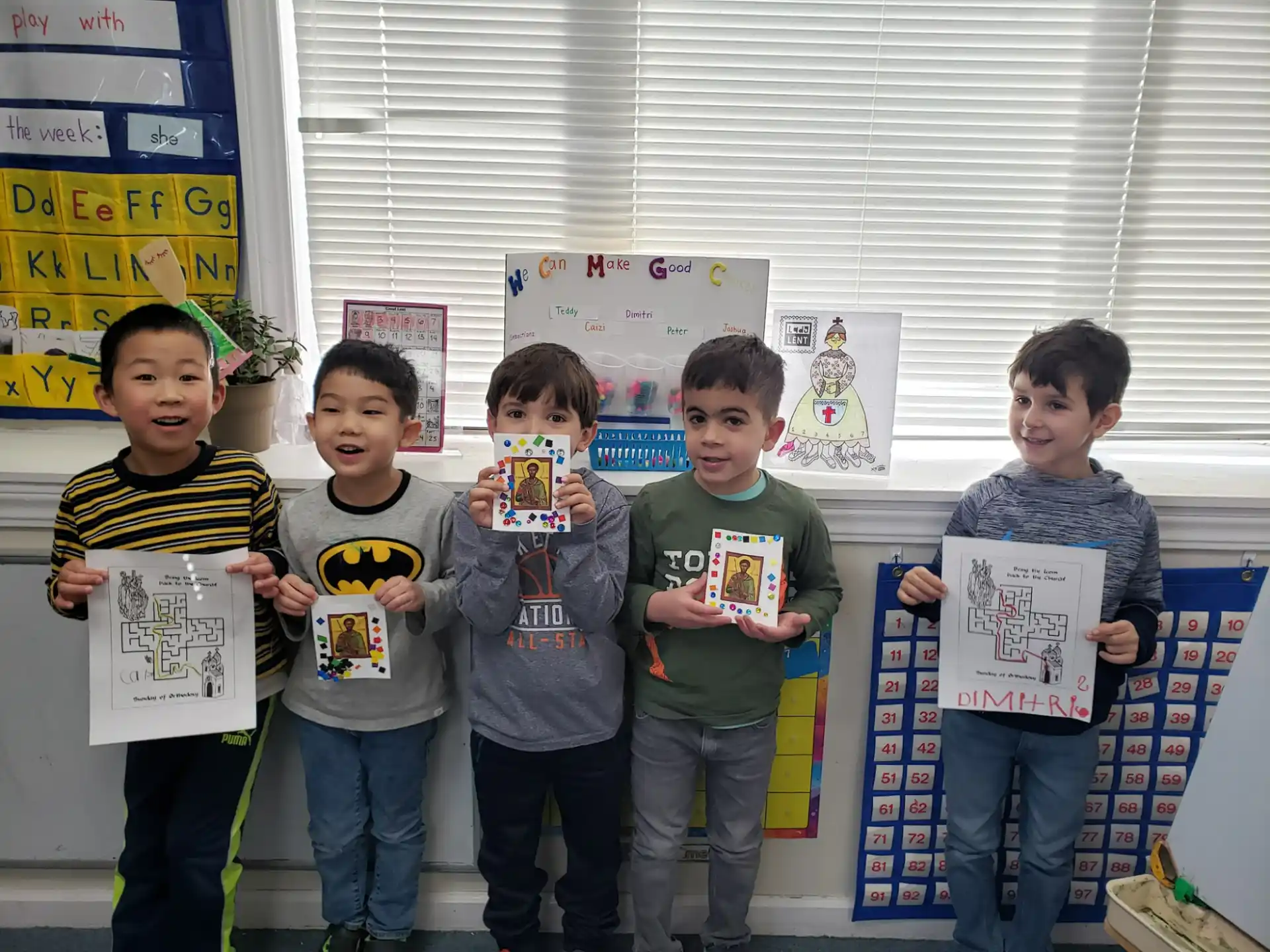 a group of boys holding up a sign