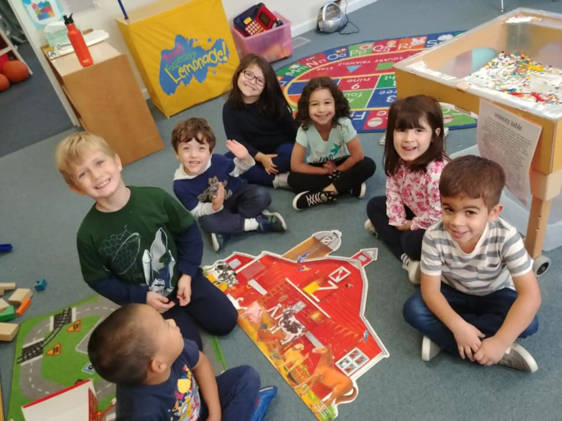 a group of children sitting on the floor