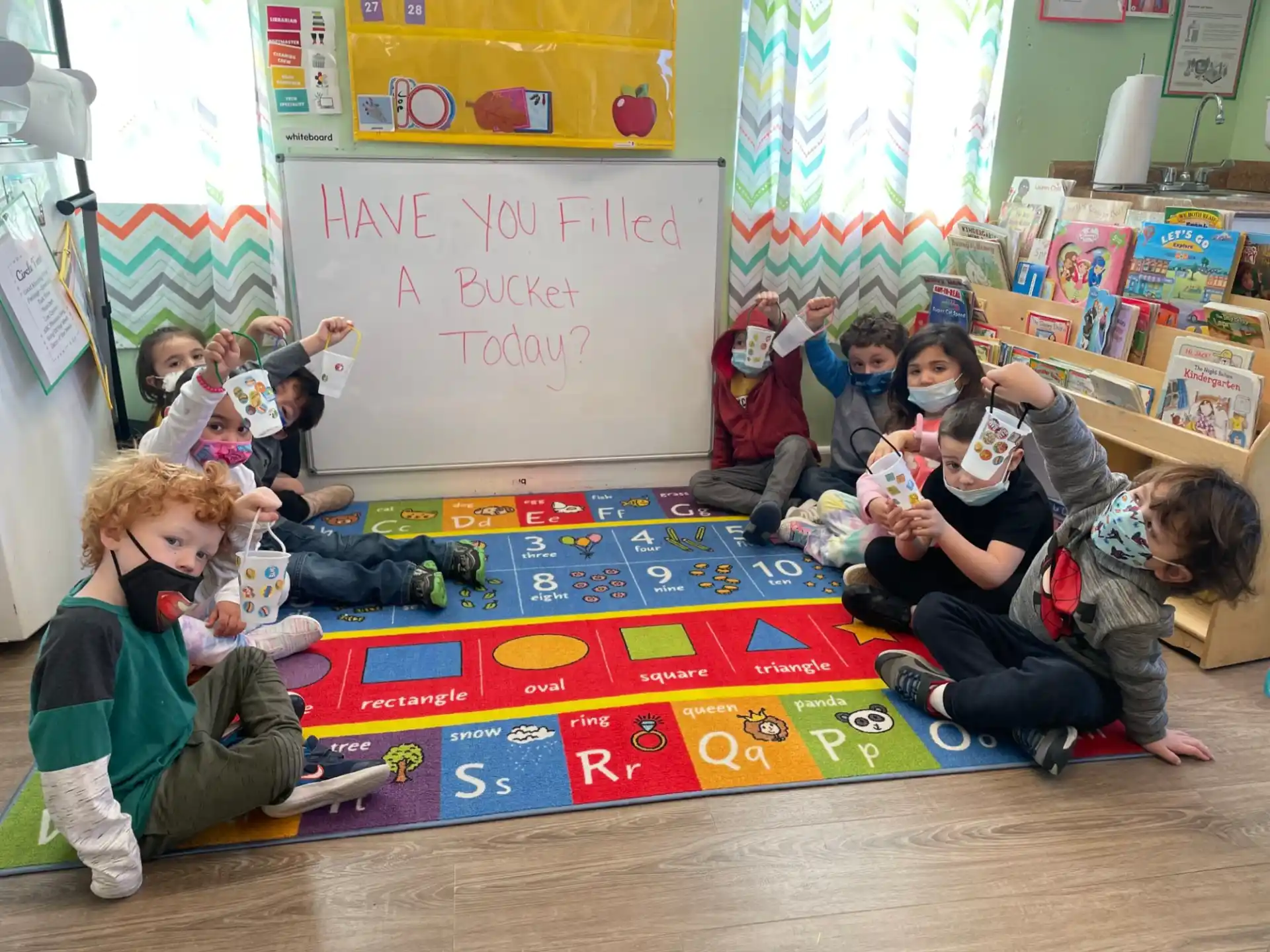 a group of children sitting on the floor